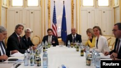 FILE - U.S. Secretary of Energy Ernest Moniz, U.S. Secretary of State John Kerry and U.S. Under Secretary for Political Affairs Wendy Sherman (L-3rd L) meet with European Union foreign policy chief Federica Mogherini (2nd R) at a hotel in Vienna, Austria,