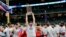 Washington Nationals first baseman Ryan Zimmerman celebrates with the trophy after Game 7 of the baseball World Series against the Houston Astros, Oct. 30, 2019, in Houston. The Nationals won 6-2 to win the series.