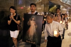 A Christian group gathers to support the anti-extradition bill protesters in Hong Kong’s Central district, Aug. 23, 2019.