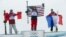Canada's second placed Mike Riddle, first placed David Wise of the U.S. and France's third placed Kevin Rolland (L-R) celebrate on the podium after the men's freestyle skiing halfpipe finals at the 2014 Sochi Winter Olympic Games in Rosa Khutor, Russia, F