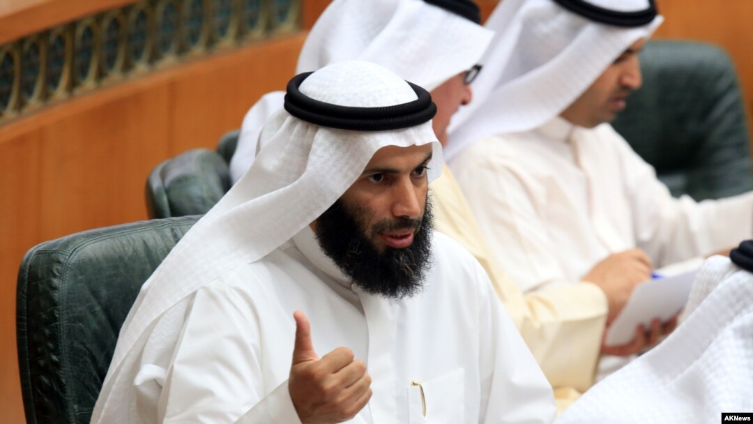 FILE - Former Kuwaiti Minister of Justice, Islamic endowments and Islamic Affairs Nayef al-Ajmi speaks at a session of Kuwait's National Assembly. Ajmi resigned in the wake of accusations by a senior U.S. official that he was enabling terrorism.