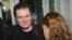 Andrzej Poczobut, a correspondent for one of Poland's major newspapers, Gazeta Wyborcza, with his wife Oksana in front of the court building where he was on trial in the town of Grodno, Belarus, July 5, 2011