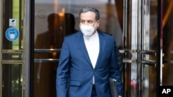 FILE - Political deputy at the Ministry of Foreign Affairs of Iran, Abbas Araghchi leaves the Grand Hotel Vienna, Austria, June 12, 2021.