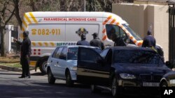 An ambulance transporting former South African president Nelson Mandela arrives at the home of the former statesman in Johannesburg, South Africa, Sept. 1, 2013.