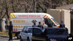 FILE - An ambulance transporting former South African president Nelson Mandela arrives at the home of the former statesman in Johannesburg, South Africa, Sept. 1, 2013.