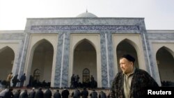 FILE - Muslims attend Friday prayers at the Hoje Ahror Vali mosque in Tashkent, Uzbekistan. 