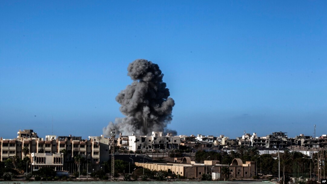 FILE - Smoke rises after an airstrike on an Islamic State target in Sirte, Libya, Sept. 28, 2016. A suspected Islamic State militant from Sirte reportedly was killed in a U.S. airstrike in the northwestern town of Bani Walid on Tuesday.