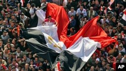 Thousands of Egyptians gather to pray and celebrate the fall of the Mubarak regime, and to maintain pressure on the current military rulers, in Cairo's Tahrir Square, February 18, 2011