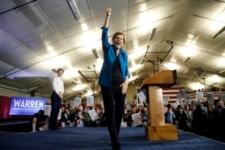 Democratic presidential candidate Sen. Elizabeth Warren, D-Mass., aknowledges supporters at a primary election night rally, Feb. 11, 2020, in Manchester, N.H.