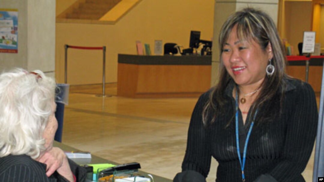 Leah Esguerra (right) is a full-time social worker assigned to work with the homeless who frequent the San Francisco Public Library.