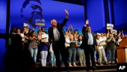 FILE - U.S. Senator Bernie Sanders, left, and Democrat Greg Edwards, Pennsylvania's 7th District Congressional candidate, wave to supporters during a rally in Allentown, Pennsylvania, May 5, 2018. 