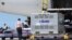 Workers unload AstraZeneca vaccine shipped from Japan in Taoyuan, July 8, 2021.