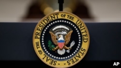 FILE - The seal of the president of the United States is seen affixed to a podium in the Roosevelt Room of the White House, in Washington, Sept. 4, 2019.