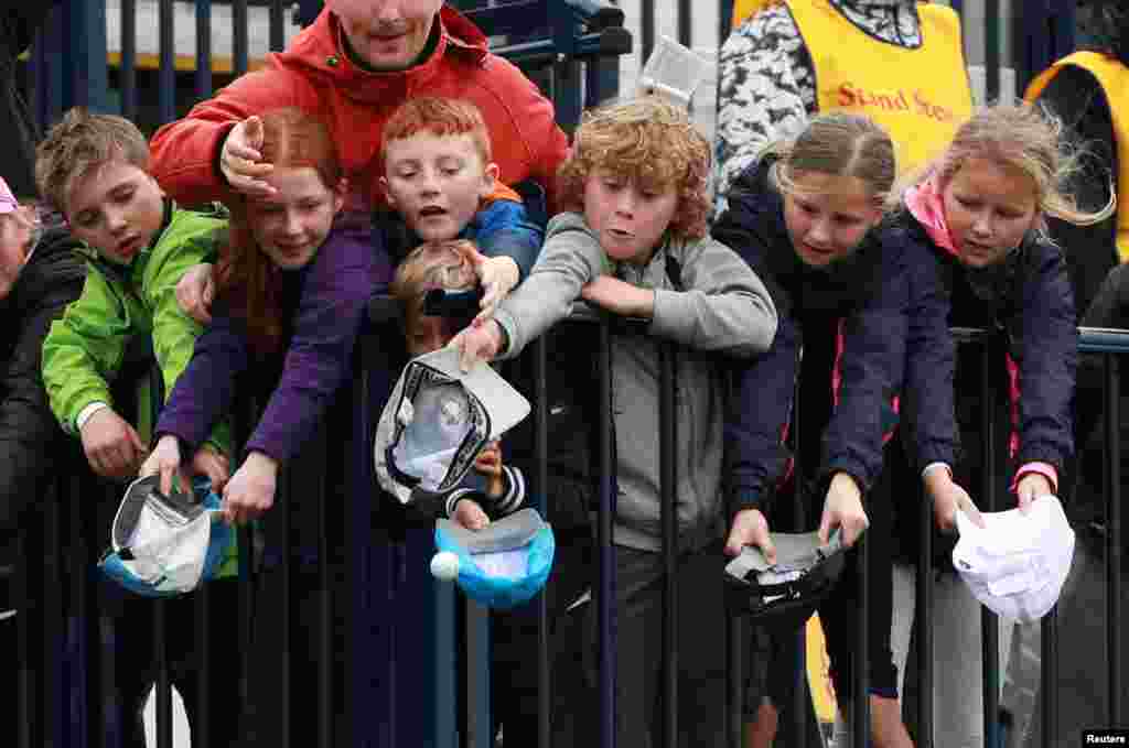 A young fan catches a ball thrown by Republic of Ireland&#39;s Padraig Harrington on the 18th during the second round of the 148th Open Championship at the Royal Portrush Golf Club, Portrush, Northern Ireland.