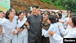 North Korean leader Kim Jong-un visits a Mushroom Farm in this undated photo released by North Korea's Korean Central News Agency (KCNA) in Pyongyang July 16, 2013.