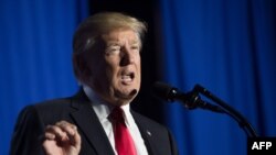 US President Donald Trump speaks to staff at the Department of Homeland Security in Washington, DC, on Jan. 25, 2017.