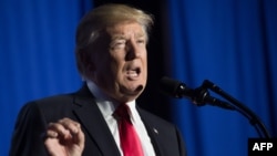 US President Donald Trump speaks to staff at the Department of Homeland Security in Washington, DC, on Jan. 25, 2017.