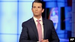 In this July 11, 2017, photo, Donald Trump Jr. is interviewed by host Sean Hannity on the Fox News Channel television program.