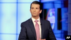 In this July 11, 2017, photo, Donald Trump Jr. is interviewed by host Sean Hannity on the Fox News Channel television program.