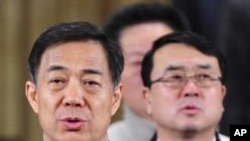 中共重庆市委书记薄熙来（左）和重庆市副市长王立军（右）（资料照）