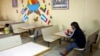 A migrant eats at Casa del Migrante, a shelter that has a capacity of more than 500 people but is currently housing only 74. Shelter administrators say they have received fewer numbers than expected in recent weeks in Ciudad Juarez, Mexico, Feb. 25, 2025. 