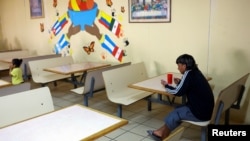 A migrant eats at Casa del Migrante, a shelter that has a capacity of more than 500 people but is currently housing only 74. Shelter administrators say they have received fewer numbers than expected in recent weeks in Ciudad Juarez, Mexico, Feb. 25, 2025. 