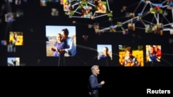 Craig Federighi, Senior Vice President of Software Engineering for Apple Inc., talks about photos within iOS at the company's World Wide Developers Conference in San Francisco, California, U.S. on June 13, 2016. 