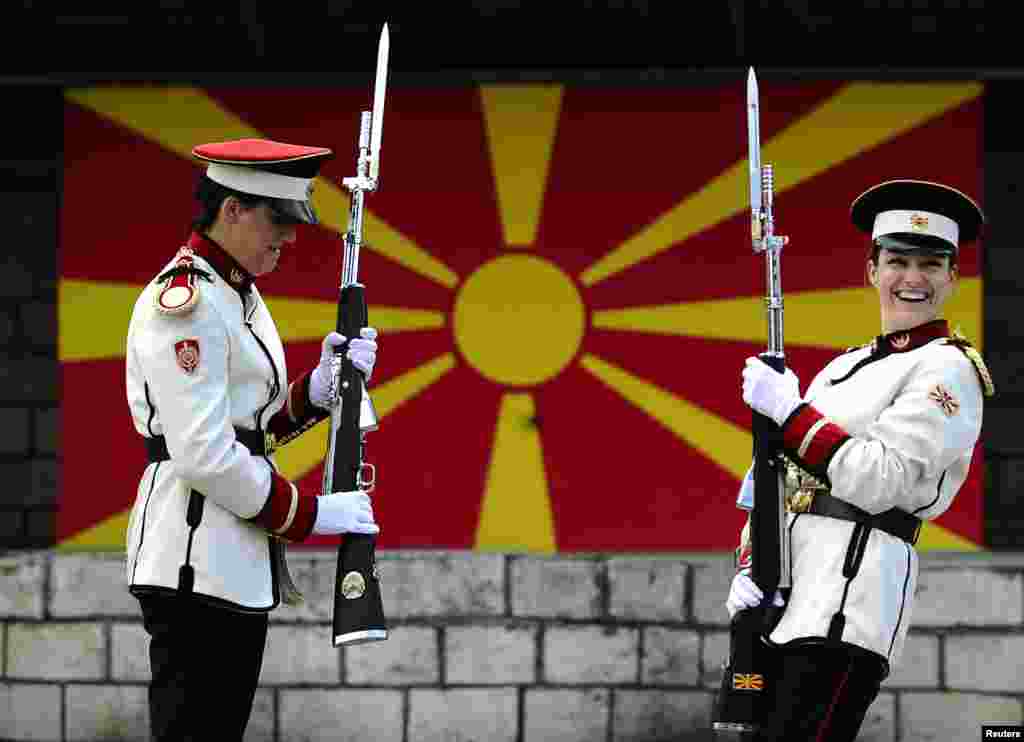 Corporals Verica Zlatevska (L) and Dragana Kitanovska attend an honor guard training session at an army barracks in Skopje, Macedonia.