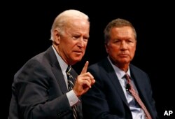 Former vice president Joe Biden, left, and Ohio Governor John Kasich participate in a discussion on bridging political and partisan divides, at the University of Delaware in Newark, Delaware, Oct. 17, 2017. “We have a president who does not understand governance," Biden said of President Donald Trump.