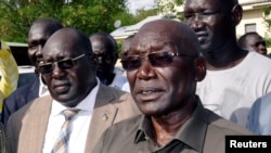 FILE - South Sudan's ousted army chief Paul Malong addresses the media after returning to the South Sudan's capital of Juba, May 13, 2017. 