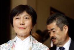 Japanese collector Fumiko Takakuwa, left, attends the handover ceremony at the National Museum, in Phnom Penh, Cambodia, July 5, 2019.