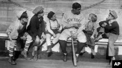 In his heyday, Babe Ruth was one of the highest paid athletes and most famous people in the world. Here, he tells children stories of his life from orphanage to baseball fame, November 29, 1924. (AP File Photo)