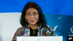 FILE - Indonesia's Fisheries Minister Susi Pudjiastuti speaks in Washington, Sept. 16, 2016. Pudjiastuti, a high school dropout turned seafood entrepreneur, is leading an Indonesian government crackdown of illegal fishing that has winning plaudits from conservationists despite its explosive methods.