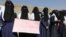 Yemeni women hold a banner as they take part in a protest marking the International Women's Day in front of the U.N. building in Sanaa, Yemen, Mar. 8, 2017. Conflict and famine has led to an increase in child marriage in Yemen, according to a report by the U.N. children's agency.