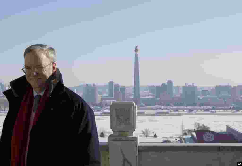 Executive Chairman of Google Eric Schmidt stands on a balcony at the Grand Peoples Study House overlooking Juche Tower in Pyongyang, North Korea, January 9, 2013.