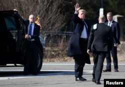President Donald Trump waves to reporters as he arrives at Walter Reed National Military Medical Center for his annual physical in Bethesda, Md., Feb. 8, 2019.