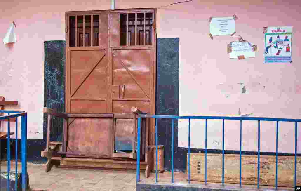 A barricaded door at the Lumley Government Hospital, that was closed after medical doctor Olivet Buck contracted the Ebola virus, near Freetown, Sept. 15, 2014.