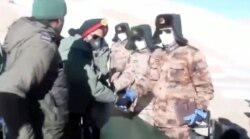 A screenshot from a video shows the disengagement process between Indian Army and China's People's Liberation Army from a contested lake area in the western Himalayas, in Ladakh region, India, Feb. 11, 2021. (Indian Army/Reuters TV/via Reuters)