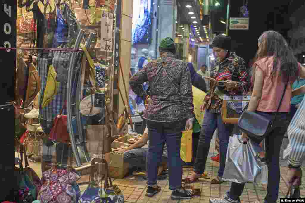 Egyptian Muslims go shopping before Eid. Wearing new clothes to welcome he end of the season are a part of the tradition.