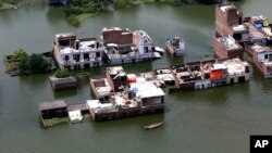 Submerged houses are seen in Allahabad, India, Aug. 26, 2016. 