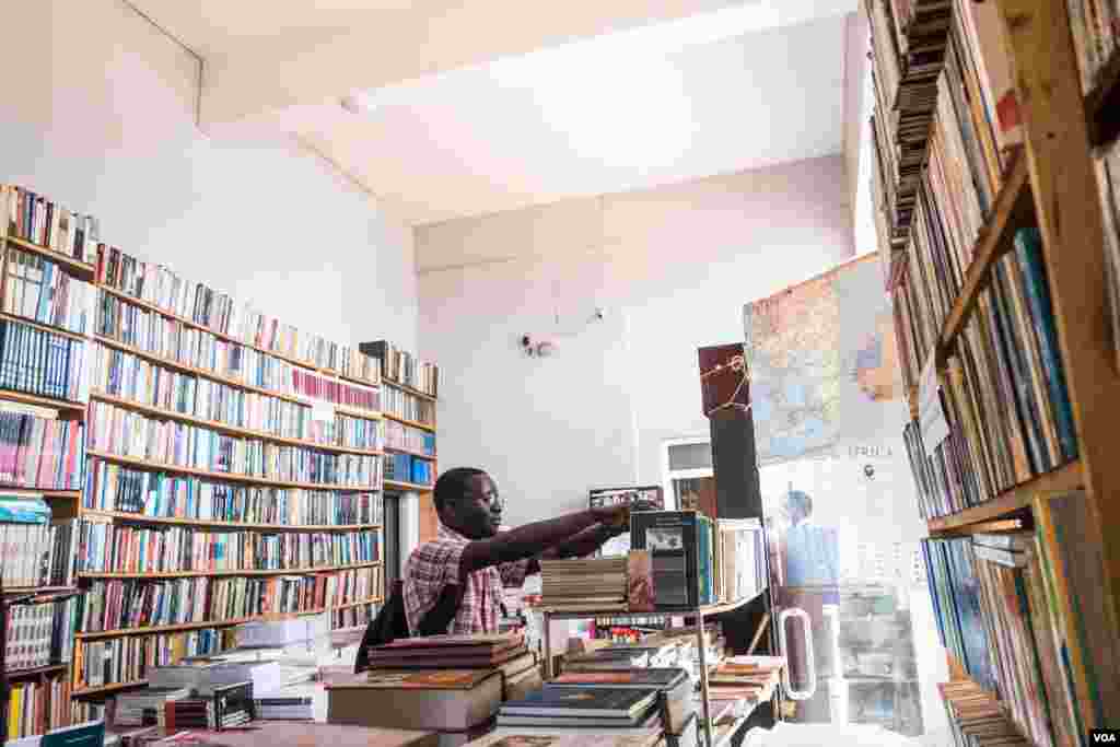 A customer is seen at the Coimbra Bookshop in Bissau, one of the few places to buy books from local authors in the capital, in Bissau, Guinea-Bissau, Dec. 19, 2017. (R. Shyrock/VOA)