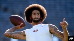 Colin Kaepernick warms up for a preseason football game against the San Diego Chargers, in San Diego, Calif., Sept. 1, 2016.