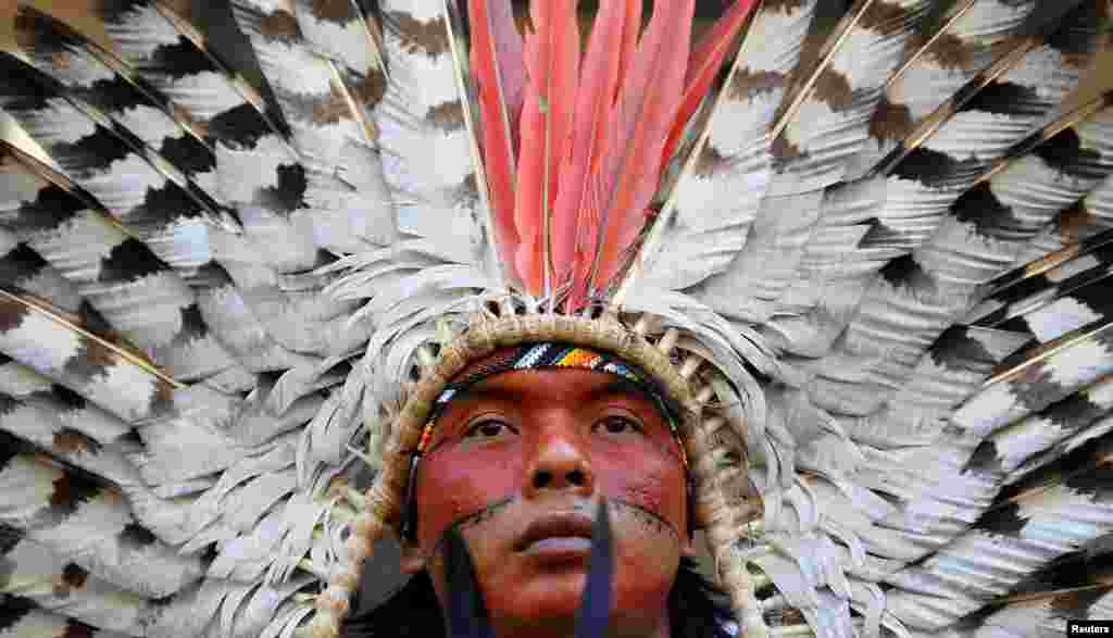 An indigenous leader of the Huni Kuin Kaxinawa from Brazil joins a protest against the Brazilian government&#39;s environmental polices, outside of the Brazilian Embassy in London, Britain.