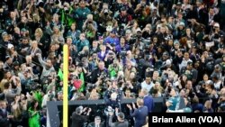 The Philadelphia Eagles are presented with the Vince Lombardi Trophy in honor of winning Super Bowl LII in Minneapolis, Minnesota (Brian Allen/VOA)