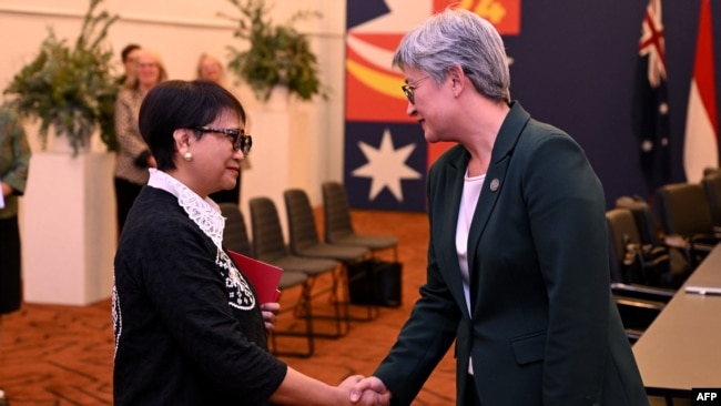 Australia's Foreign Minister Penny Wong, right, greets Indonesia's Foreign Minister Retno Marsudi during the Australia-ASEAN summit in Melbourne on March 4, 2024.