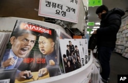 FILE - A magazine with caricatures of then-U.S. President Barack Obama and North Korean leader Kim Jong Un is displayed at a book store in Seoul, South Korea, Jan. 3, 2015.