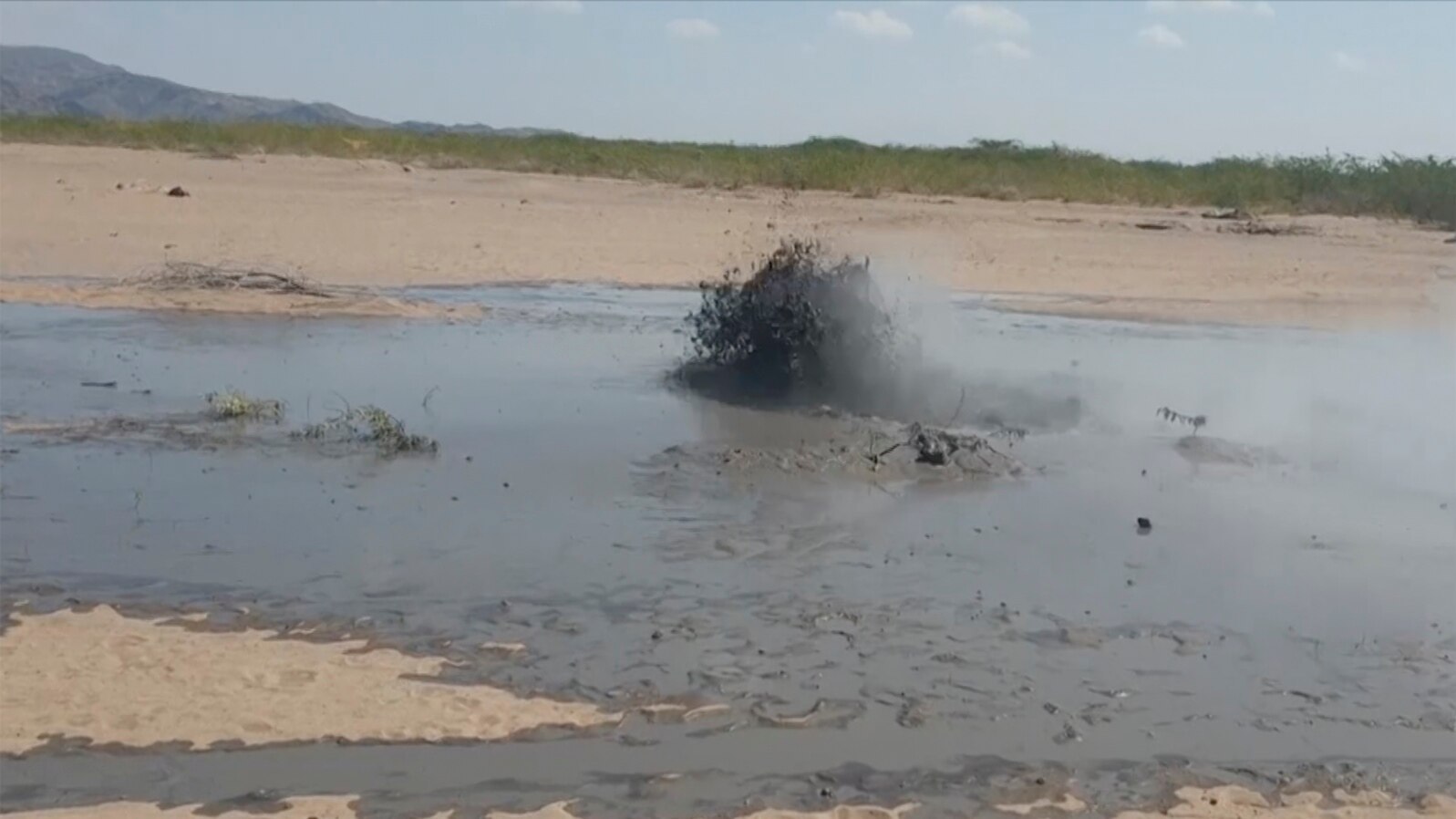 In this image taken from video, mud bubbles up near volcanic activity in the Sagento Kebele Village, Afar region, Ethiopia, on Jan. 4, 2025. 