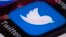 FILE - The Twitter app is seen on a mobile phone in Philadelphia.