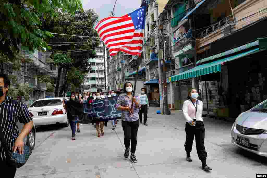 People march with the federal flag as they support National Unity Government (NUG) which has been recently announced by Committee Representing Pyidaungsu Hluttaw (CRPH) in Yangon, Myanmar.