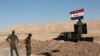 Shiite Popular Mobilization Forces take control of a former Kurdish security forces checkpoint outside Bashiqa, Iraq, Oct. 18, 2017. 